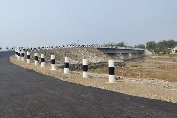 The completed Harmoti bridge with new approach road and bollards