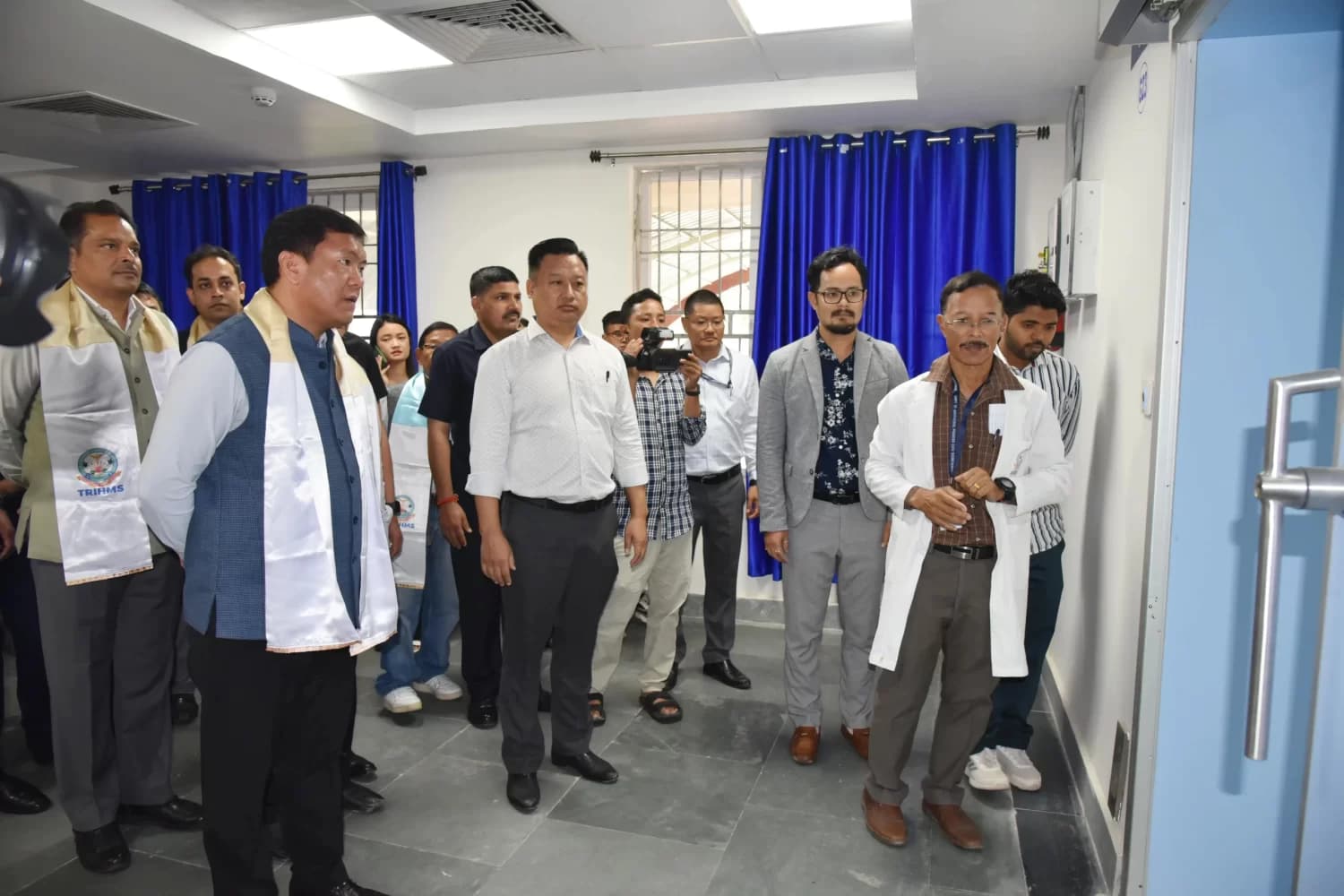 State dignitaries touring a completed TRIHMS facility