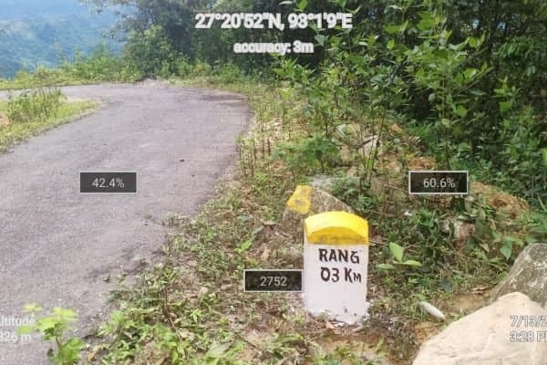A sealed hill road carved into the Arunachal mountainside
